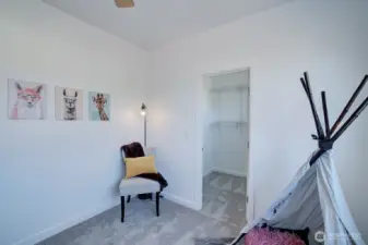 This upstairs bedroom has a walk in closet.