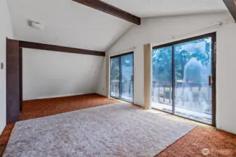 Largest bedroom upstairs with double sliders to upper deck out front