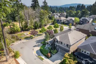 Corner lot provides open view through wall of windows, playground acroos the street