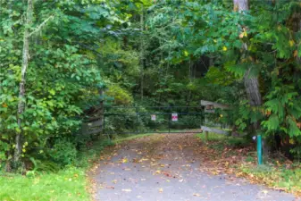 Entering the property through the secondary private gate.