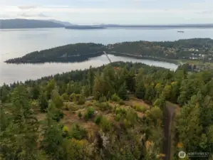 A drone view from the eastern border of the property showing the build site (fire pit) looking west.