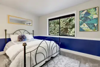 Upstairs bedroom #1 looks out into the backyard.