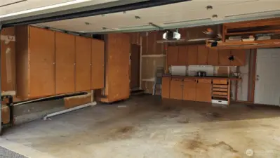 Garage has a workbench in the back and a bunch of storage for all your goodies. Door also leads to the backyard.