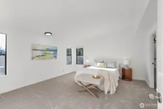 Large primary suite with a walk in closet, and private bath with soaking tub, shower, and double vanity.