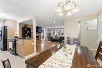 dining room looking into kitchen and living room