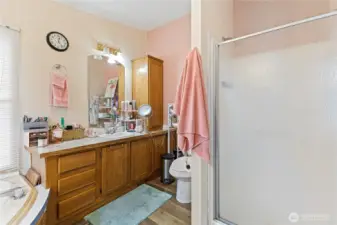Primary with walk in shower and large soaking tub