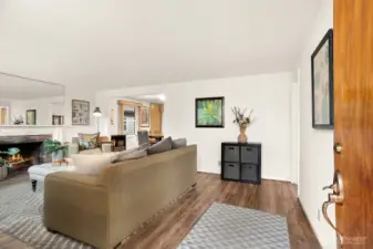 Cozy Living room w/ fireplace and partial views of Sound & Olympics.