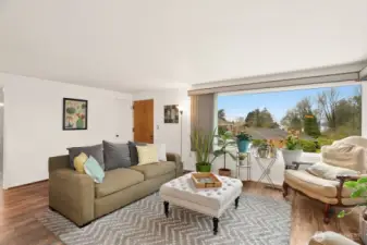 Cozy Living room w/ fireplace and partial views of Sound & Olympics.