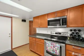 Lower level ADU w/ bedroom, gas fireplace, living room, 3/4 bath, kitchen, laundry and access to 1 car garage.