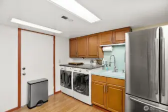 Lower level ADU w/ bedroom, gas fireplace, living room, 3/4 bath, kitchen, laundry and access to 1 car garage.