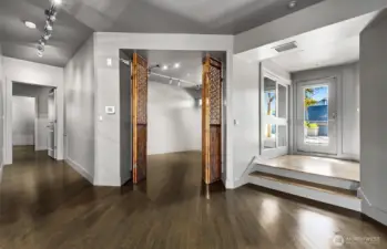 Entry looking into the third bedroom used as office/den (no legal egress).