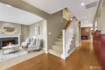 As you enter the home, there is the living room off to the left, 3 of the bedrooms up those stairs and the dining room is to the right.