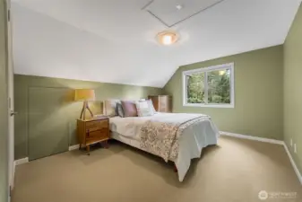 Bedroom 2 is upstairs, just above the laundry room. It is the same size and configuration as Bedroom 3.