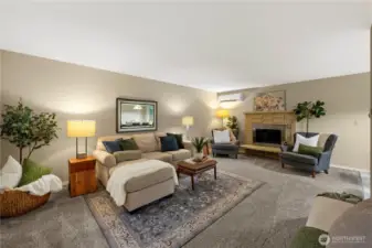Gracious sized living room with large wood burning stove.