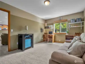 The den, home office or bonus room is located just off the family room.