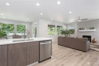 Wood cabinets that self close. Great view of living/dining featuring the large windows.