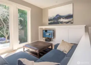 Thoughtful touches include a sliding cabinet that hides the TV, preserving clean lines and a minimalist look when it’s not in use.