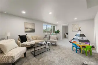 Downstairs living area with new carpet and daylight windows
