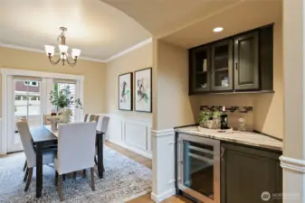 Dry bar with wine refridgerator off the dining room.