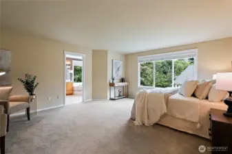 Spacious primary bedroom with plenty of space for a King Bed and sitting area!