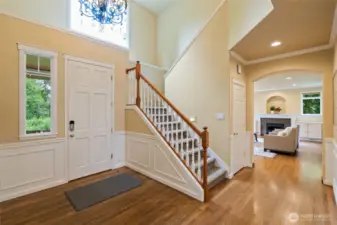Entry with hardwood floors and vaulted ceilings.