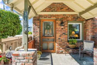 Your covered front porch, complete with vintage screen door and creeping vines, is the perfect spot to sit in the shade and watch the world go by.