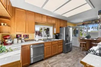 Newer induction range, double drawer dishwasher, fridge and cheerful pops of color!