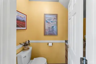 1/2 bath is located off the kitchen.