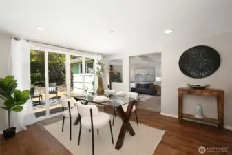 Light filled dining room with access to composite deck.
