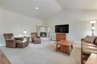 Extra large great room with a remote controlled fully tiled gas fireplace.