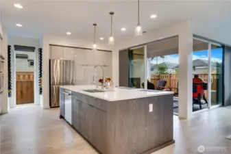 Sliding glass doors dissolve open, turning the patio into an extension of the great room-gas fireplace already installed, while the ceiling's neatly plumbed and ready: just hook up your own heaters, and you're golden.