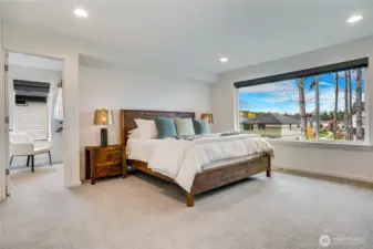 Lush primary retreat-picture windows overlooking the greenbelt, plus upgraded padding under carpet for extra comfort.