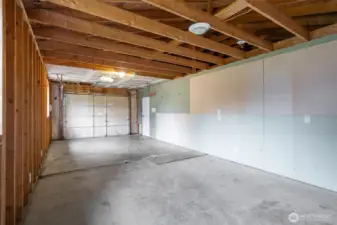 Garage door on on side and pass through door to kitchen.