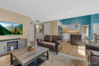 The family room is located just off the kitchen and features wonderful hardwood floors.