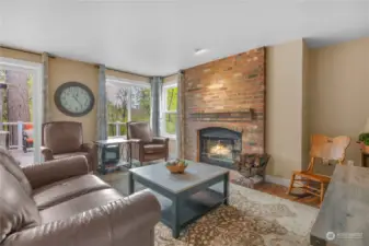 The family room features hardwood floors and wood-burning fireplace for those cool evenings.
