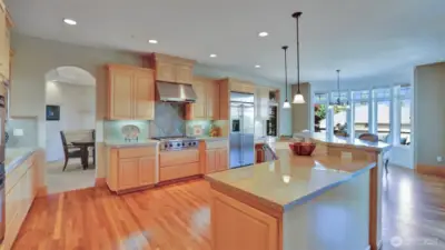 Raised eating bar, 6-burner stove, extensive granite countertops, and planning desk make this kitchen both beautiful and functional