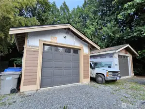 Two detached garages offer abundant space for vehicles, hobbies, or future workshops—both currently unfinished, giving you the freedom to customize them to suit your needs and style.