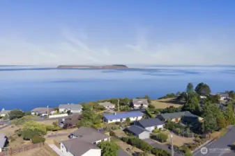 Aerial view with this home in the front left, gives you a sense of the neighborhood and expansive views.  Just minutes to downtown, this area is a Port Townsend treasure.