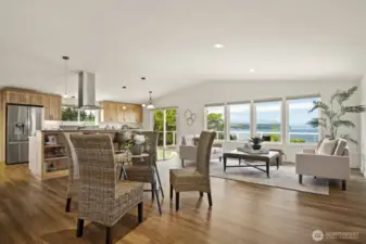 As you enter the front door, you will be immediately greeted by the gorgeous views of the water, boats, and mountains beyond.  Your view is to the west - so yes!  Gorgeous sunsets too.  And what a beautiful room