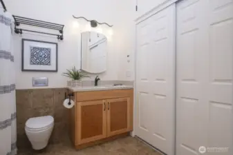 The second full bath on the south side of the house has a full closet for storage!