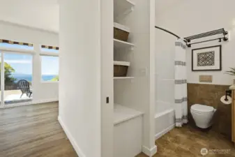 Second bathroom on the right, showing hallway to the second bonus room and second bedroom - all in a separate wing of the house.