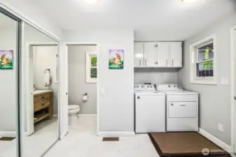 Spacious laundry suite with all new tile flooring, fresh paint and powder bath.