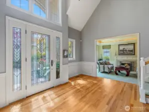 2 Story Entry-way with Leaded Glass Door and Gleaming Hardwood Floors