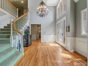 Entry with Gleaming Hardwood Floors and Stairway to the 2nd Floor.