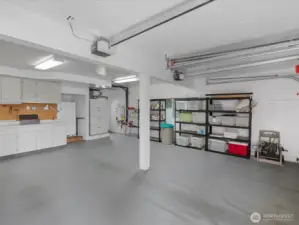 3 Car Garage with Built-in Cabinets and Work Space