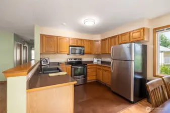 Kitchen has upgraded appliances and sink.