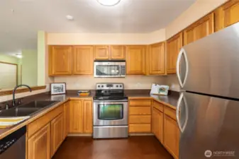 Kitchen has upgraded appliances and sink, bamboo flooring.