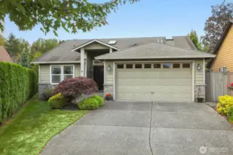 Welcome to your new home! This charming residence greets you with curb appeal, a beautifully landscaped yard, and an inviting entryway.