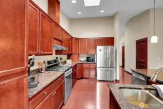 Granite countertops and stainless steel appliances.