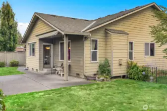 Enjoy indoor-outdoor living with a partially covered patio and a spacious, private backyard.